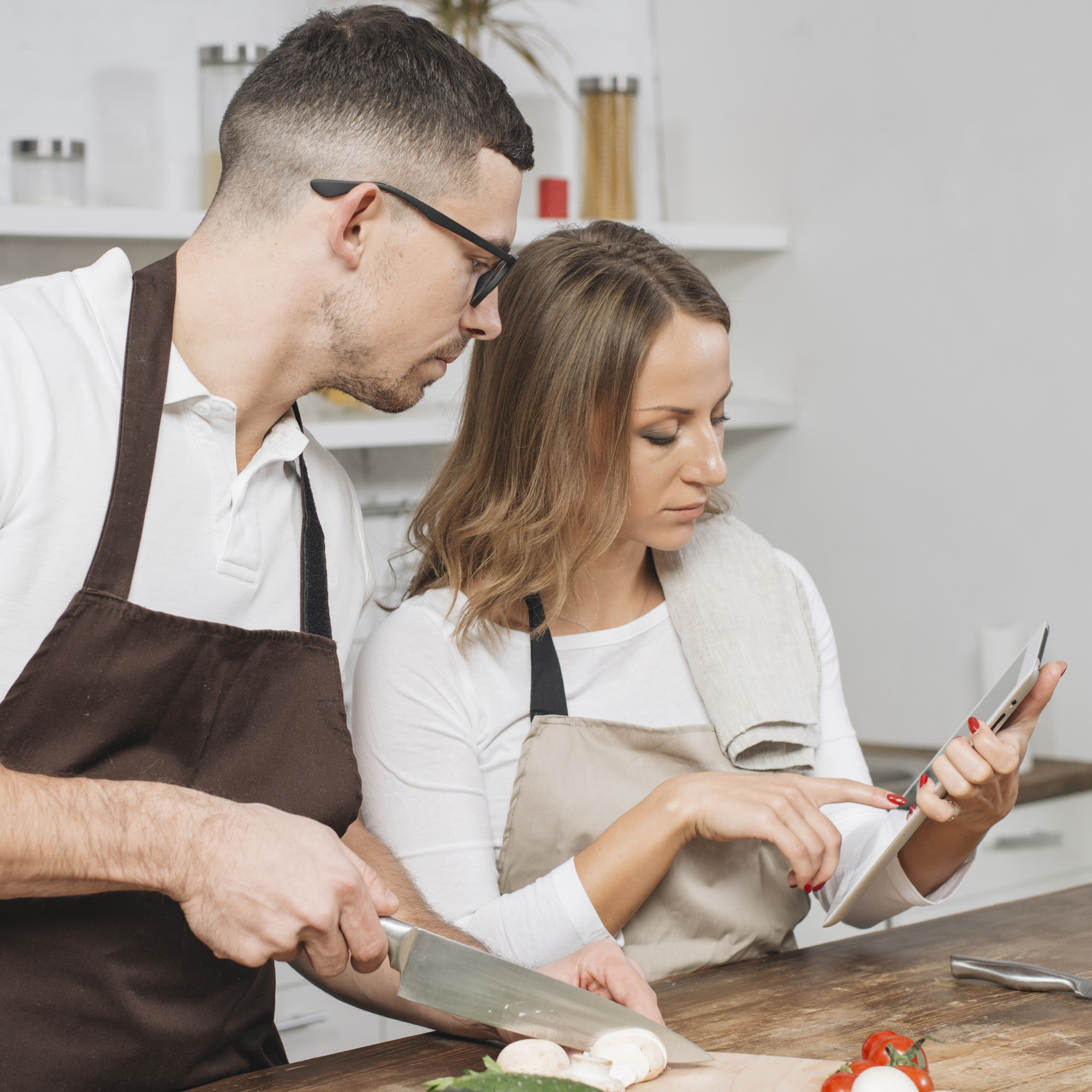 Chef consulting with client in kitchen